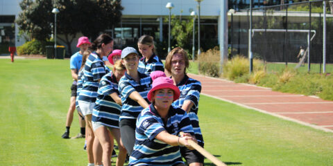 St Cats students competing in a Tug of War game