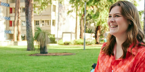 Curtin student smiling outside on campus