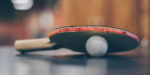 Table tennis bat and ball.