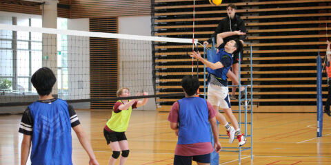 Students playing volleyball at Curtin Stadium.