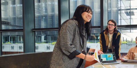 Postgrad students chatting and learning together.