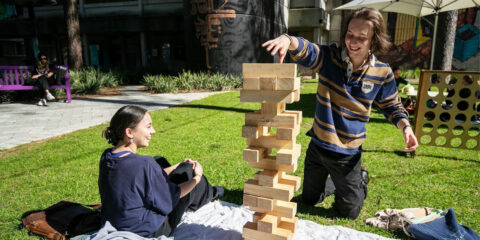 students playing giant jenga.