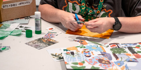 Student creating a collage.