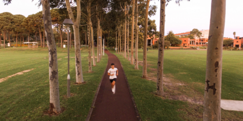 A person running on campus
