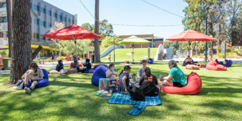 Students sitting outside at the Creative Quarter