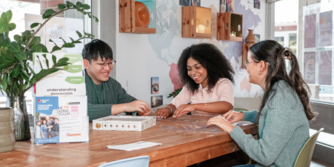 Three students inside The Living Room space at Curtin University