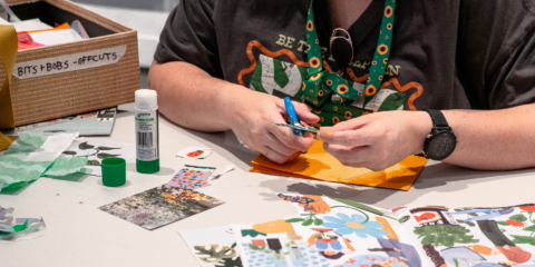 hands on a table doing arts and crafts