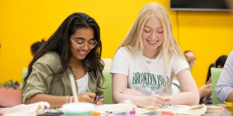 Two female students doing arts and crafts